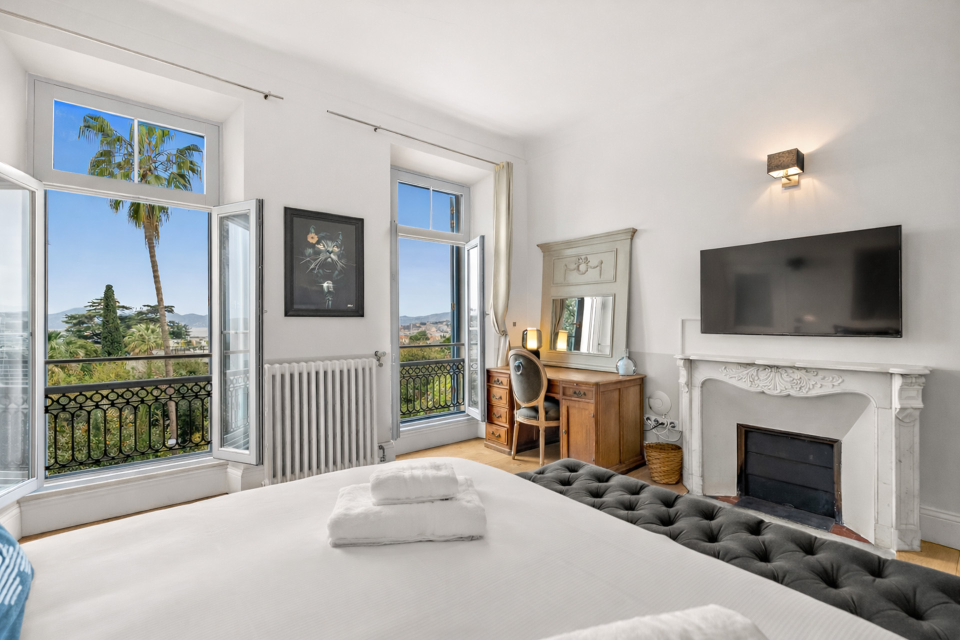 Bright bedroom with open garden views at Château Les Alouettes Cannes